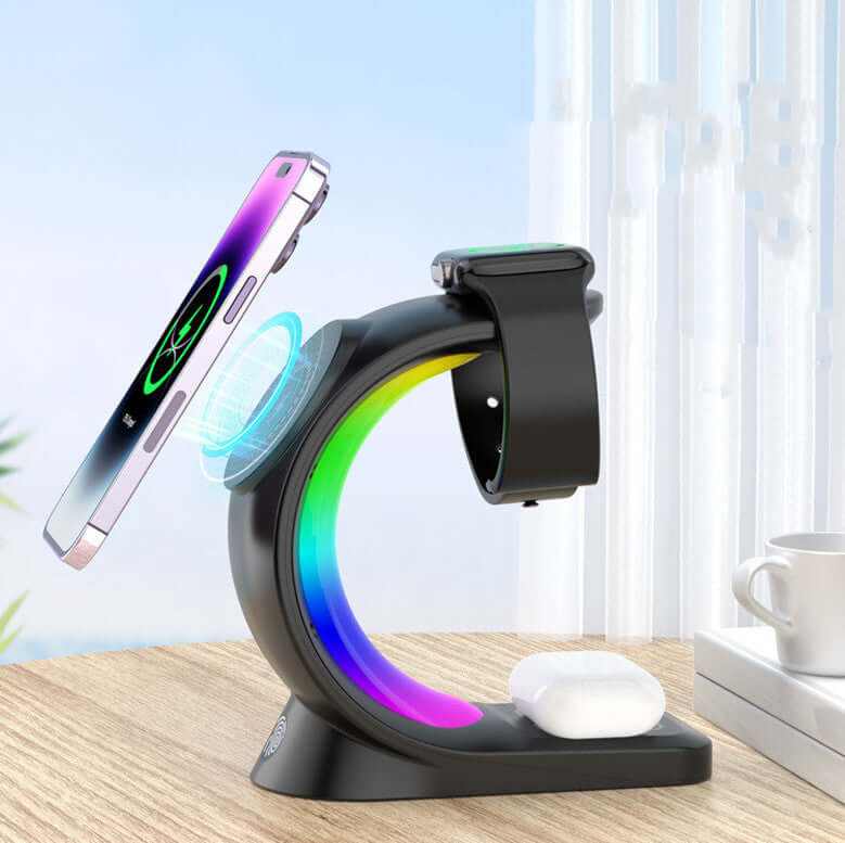 Magnetic wireless charger with RGB lighting, charging phone and smartwatch on a desk.
