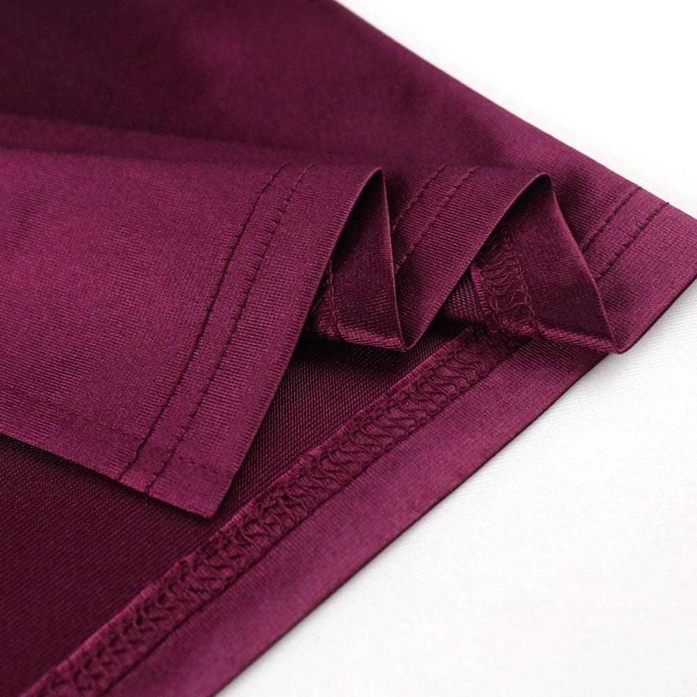 Close-up of the luxurious matel silk fabric in burgundy, showcasing detailed stitching for a stylish summer dress.