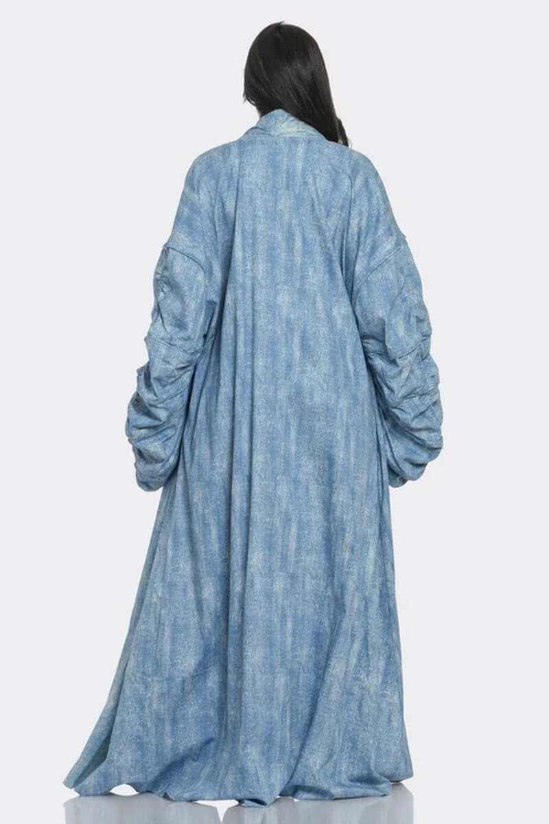 Back view of a maxi longline denim duster coat with exaggerated ruched sleeves in light wash denim.
