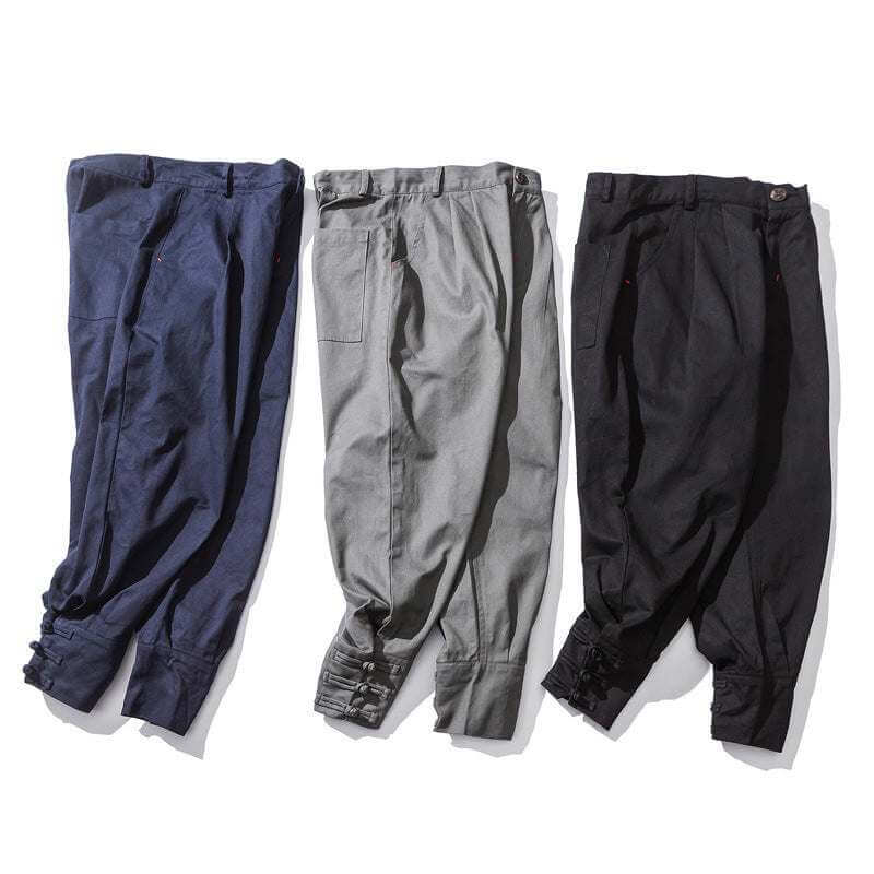 Men's buckle casual pants in cotton blend fabric available in blue, gray, and black colors.
