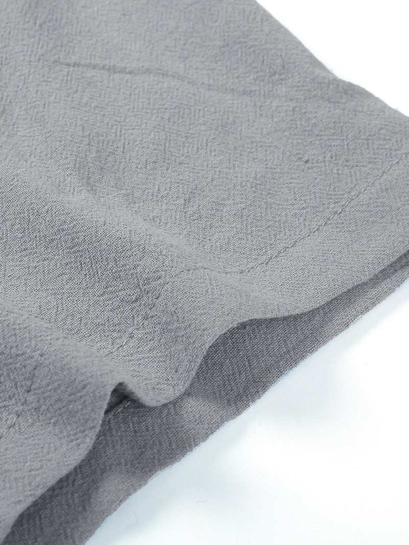 Close-up of gray men's short sleeve beach shirt fabric showing linen-cotton texture