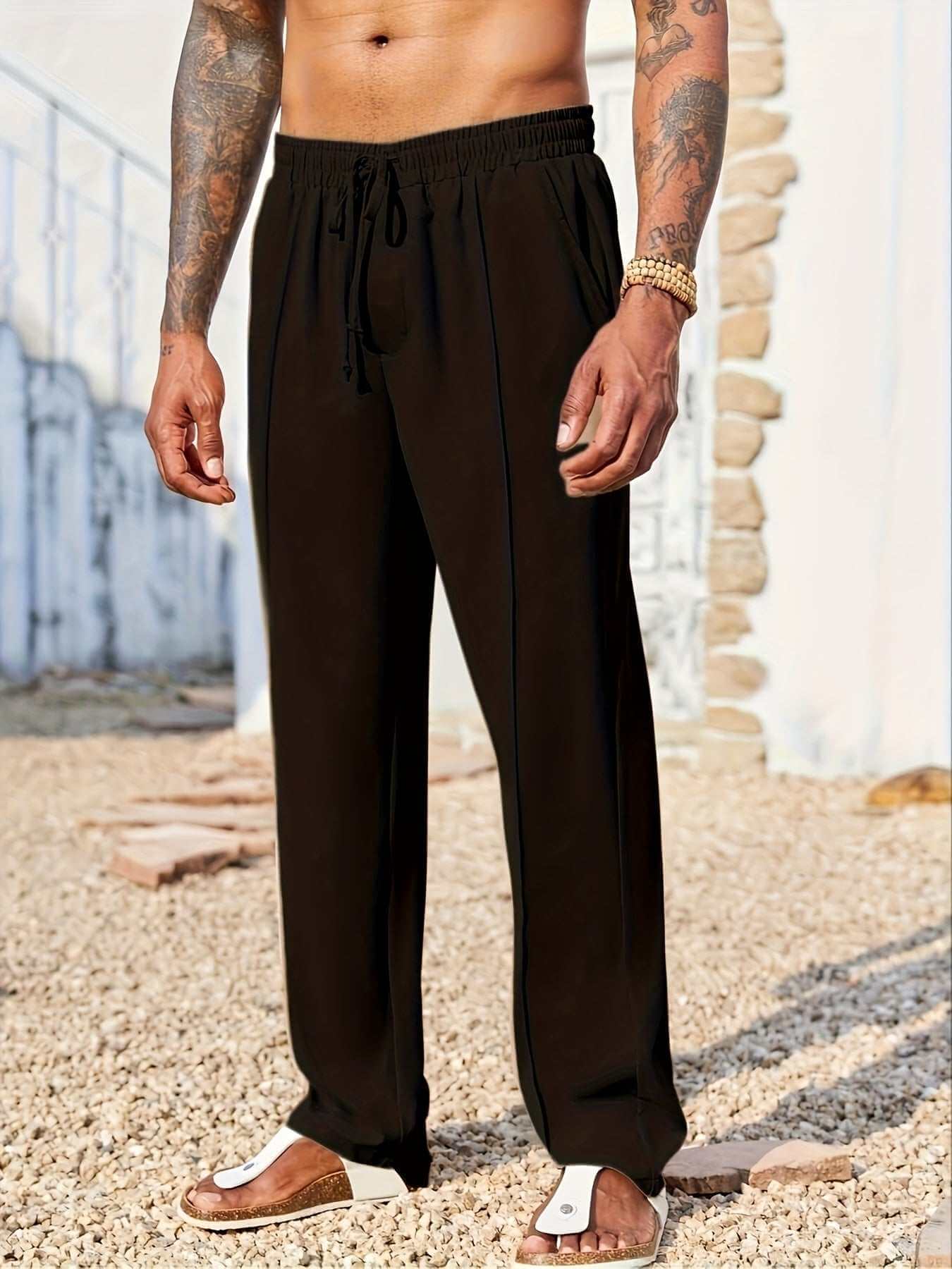 men's trendy casual black corduroy pants with drawstring waist worn outdoors