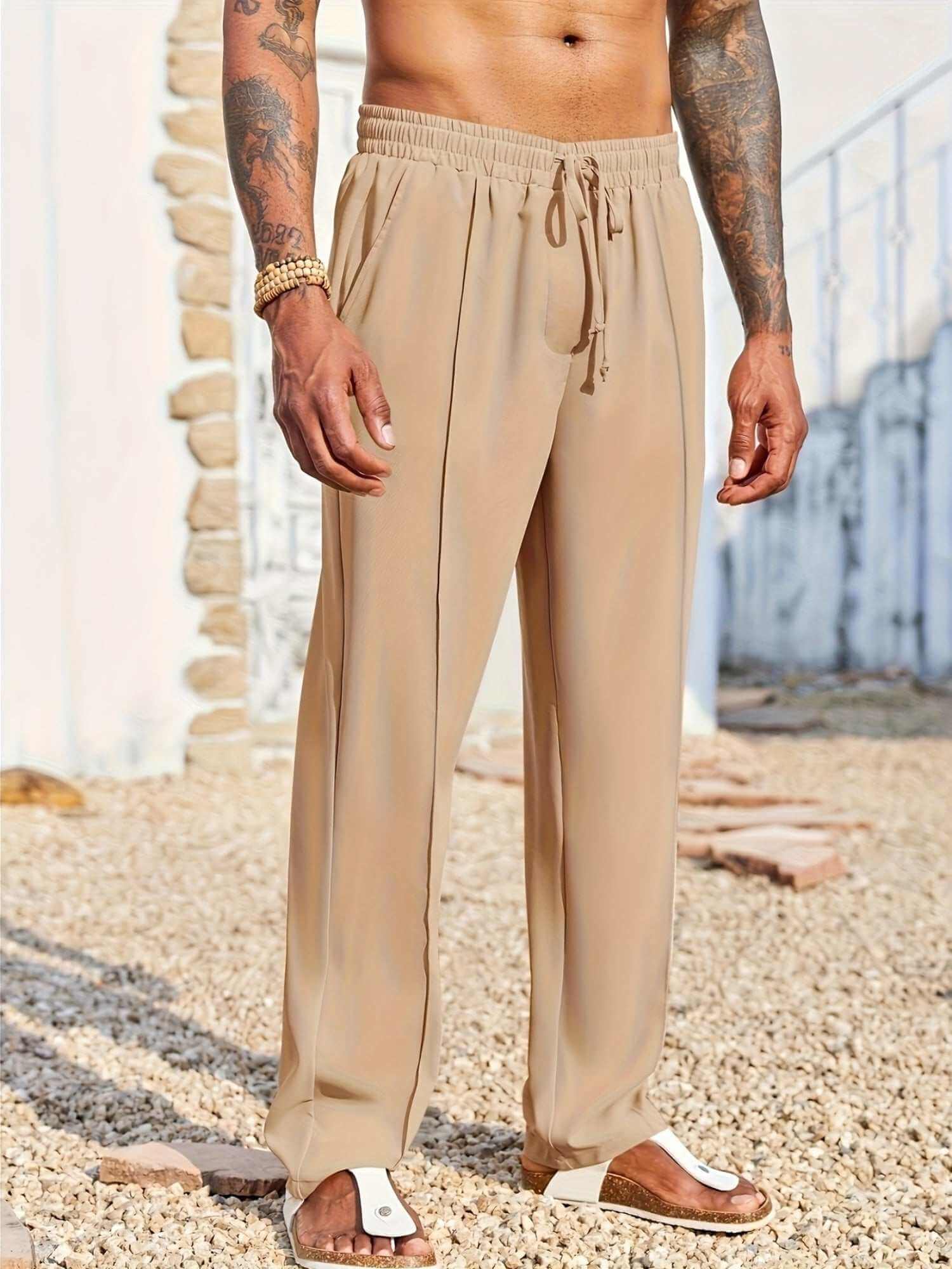 men's trendy casual beige drawstring pants with relaxed fit worn outdoors