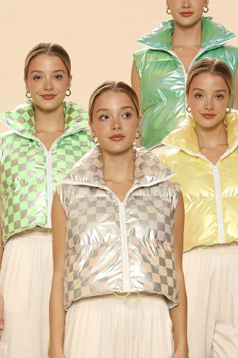 Group of models showcasing metallic puffer vests in various colors, featuring mock necks and cropped designs.