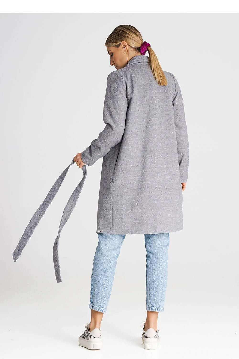 Model wearing a minimalist Figl buttoned midi coat from the back, featuring a large collar and attached belt.