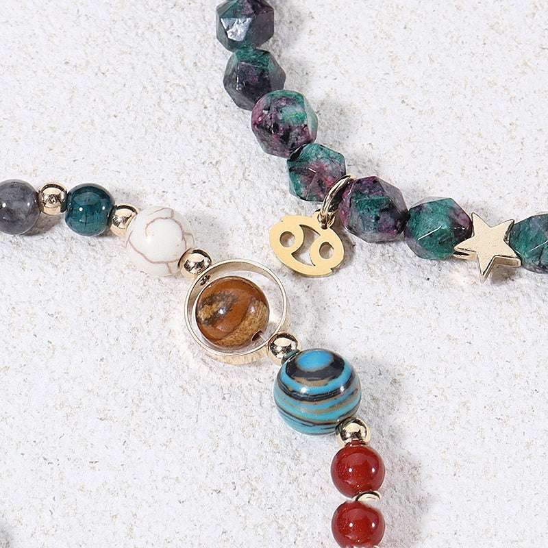 Close-up of natural stone bracelets featuring twelve constellations zodiac charms
