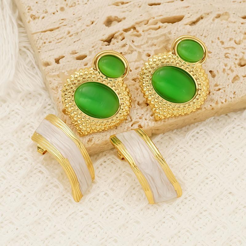 Opal stainless steel gold-plated women's studs with green oval stones and geometric design