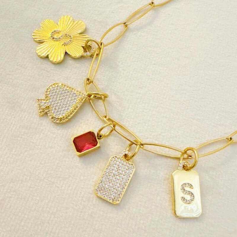 Personalized Lucky Clover Initial Seamless Charm Clip with gold charms and sparkling initials for custom jewelry fashion.