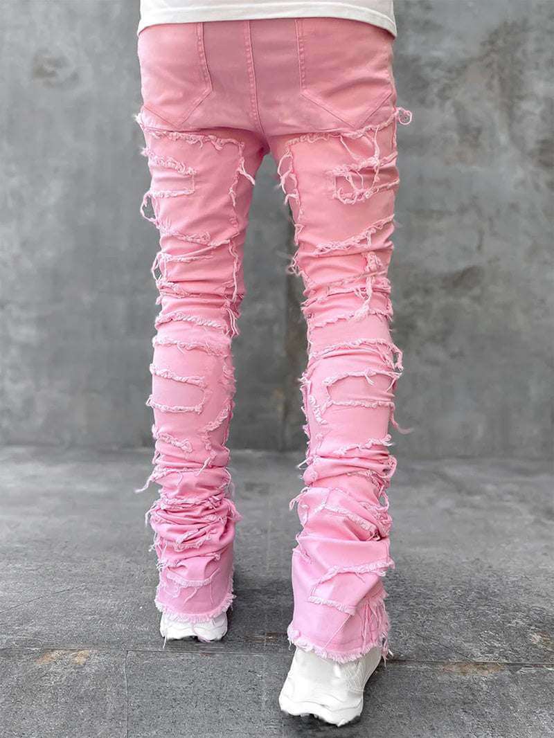 Pink stacked jeans for men with distressed design and cotton fabric
