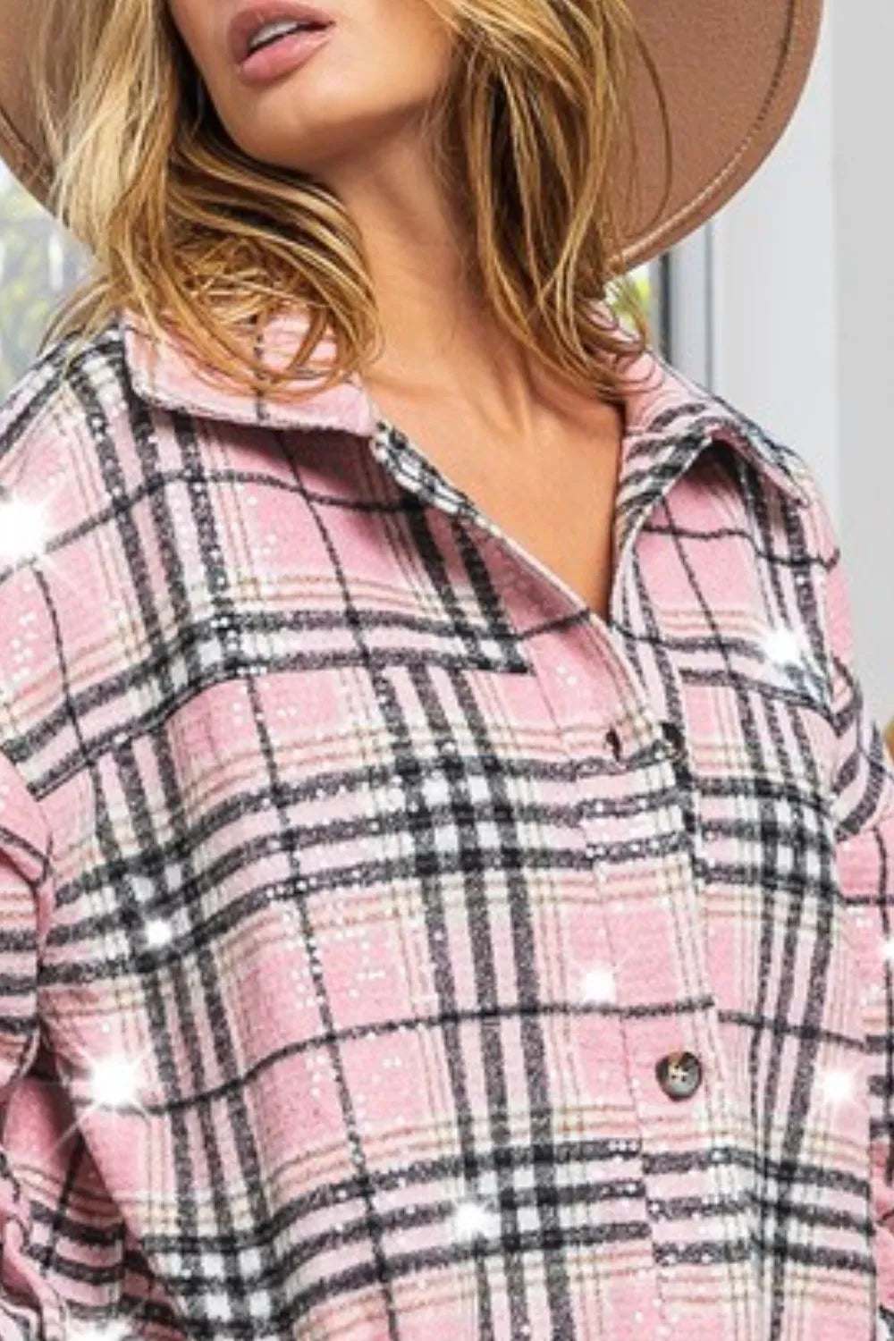 Close-up of a woman in a pink plaid sequin jacket, showcasing vintage style with modern glamour and clear sequins.