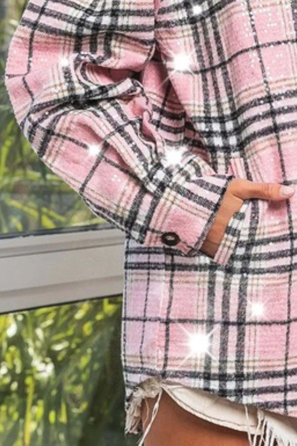 Close-up of pink plaid sequin statement jacket showing sparkling sequins and stylish button detail.