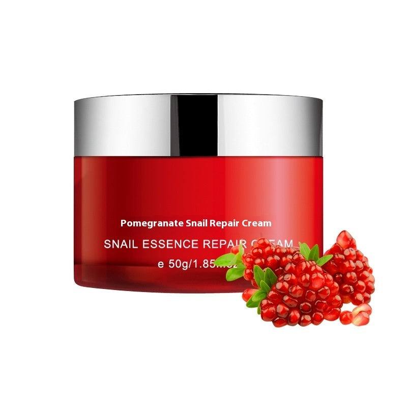 Pomegranate set moisturizing cosmetics with snail repair cream and fresh pomegranate fruit decoration