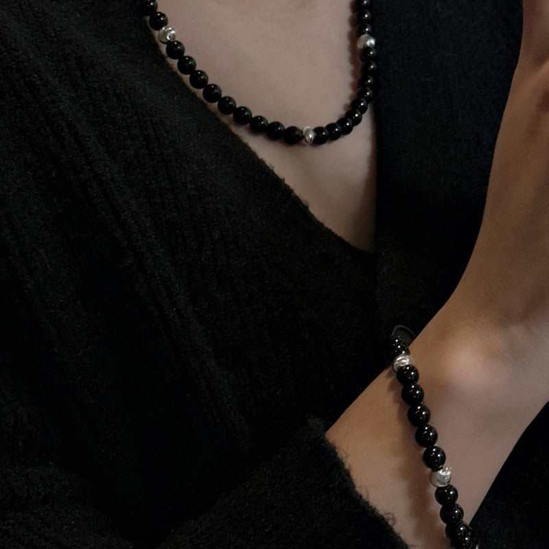 Women's S925 sterling silver black agate cat's eye bracelet with electroplated beads on wrist
