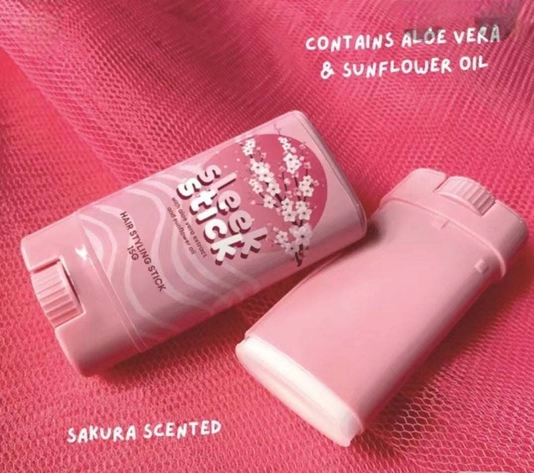 Pink sleek hair wax stick with sakura scent and aloe vera, sunflower oil for smooth frizzy hair control