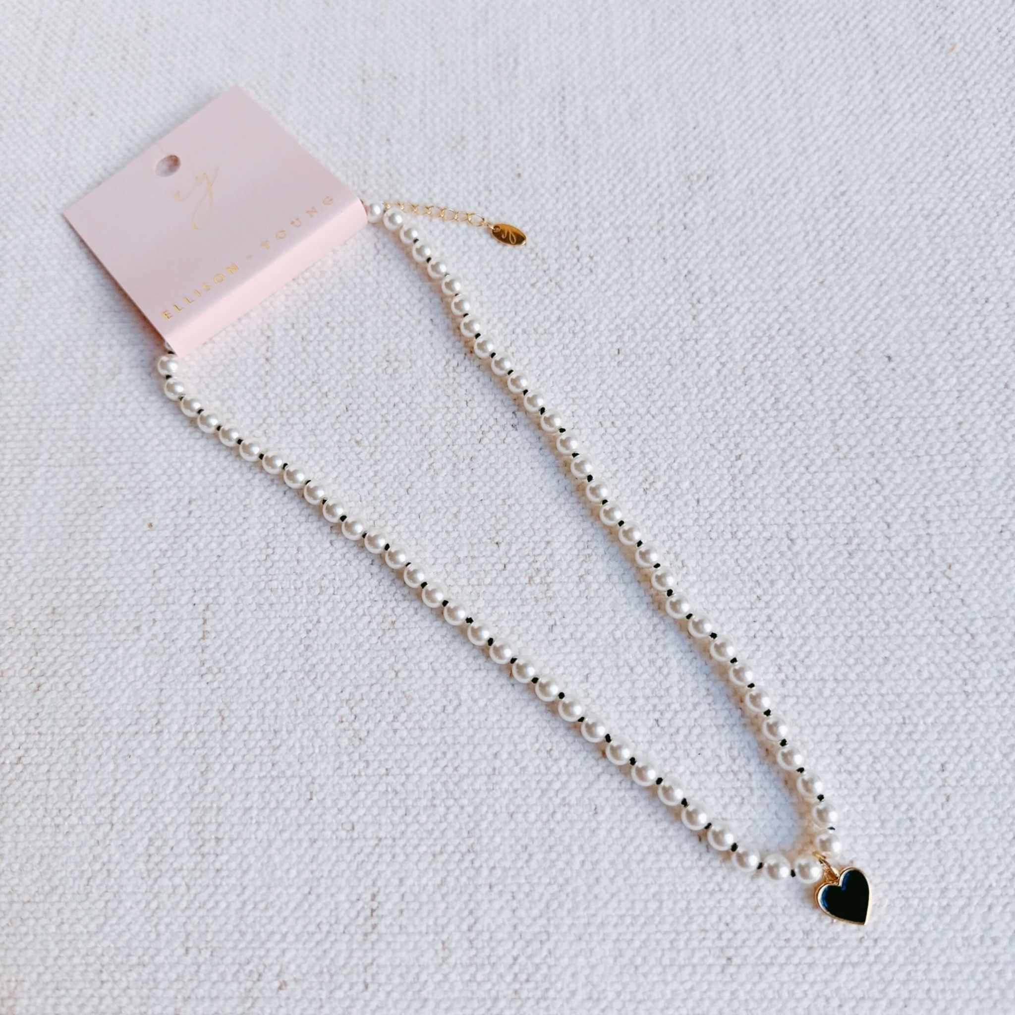 Silky Adjustable Thread Heart Pendant Necklace with pearl beads and black heart charm, elegant accessory for any outfit.