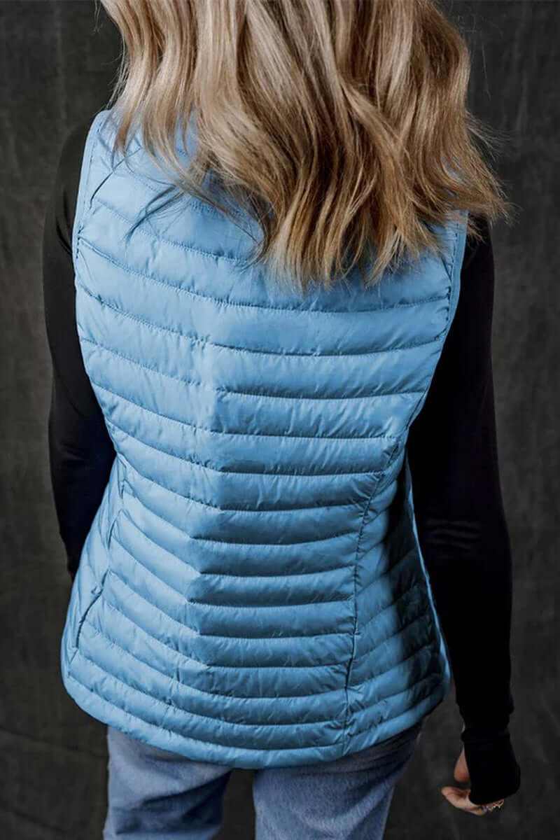 Back view of a sky blue plush collared quilted zipped puffer vest, showcasing its sleek design and warm insulation.
