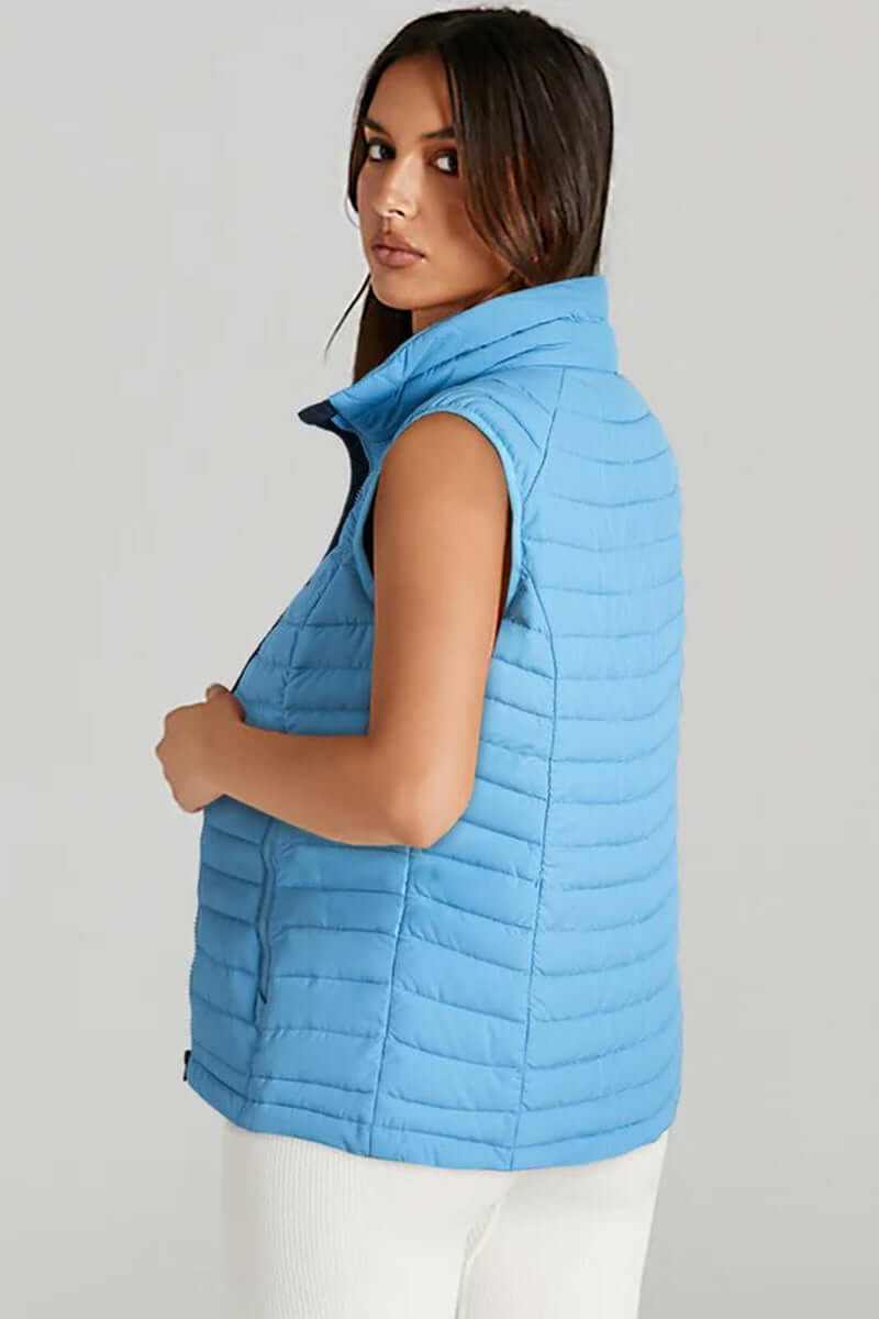 Sky blue plush collared quilted zipped puffer vest, sleeveless design, stylish and warm layering piece.