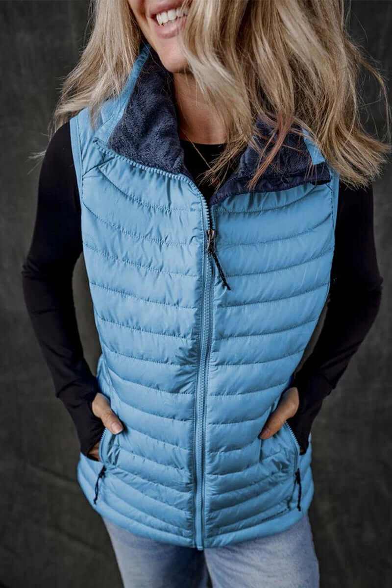Sky blue plush collared quilted zipped puffer vest for versatile layering and style.