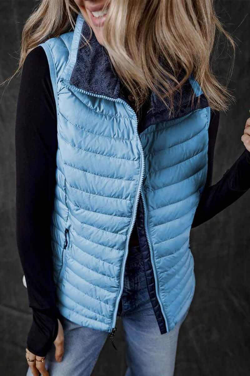 Sky blue plush collared quilted zipped puffer vest, perfect for layering with added warmth and style.