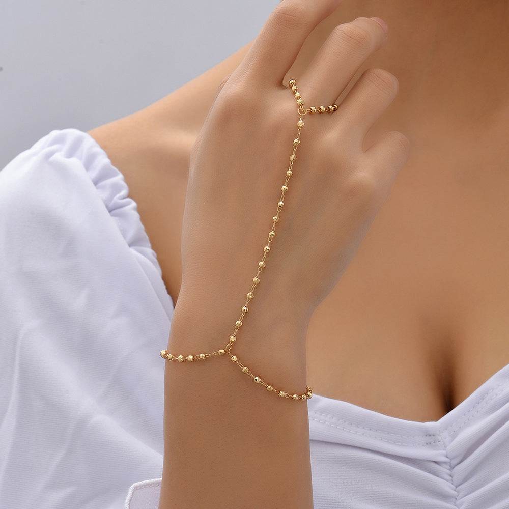 Gold small beads wafer chain mitten-type bracelet worn on hand and finger