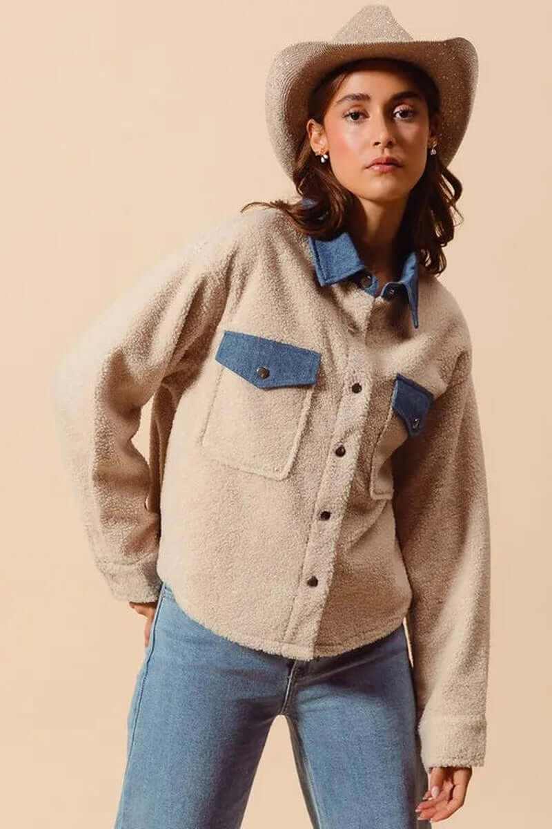 Model wearing SO ME Faux Sherpa Fur Shacket with denim collar, styled with a cowboy hat and jeans.
