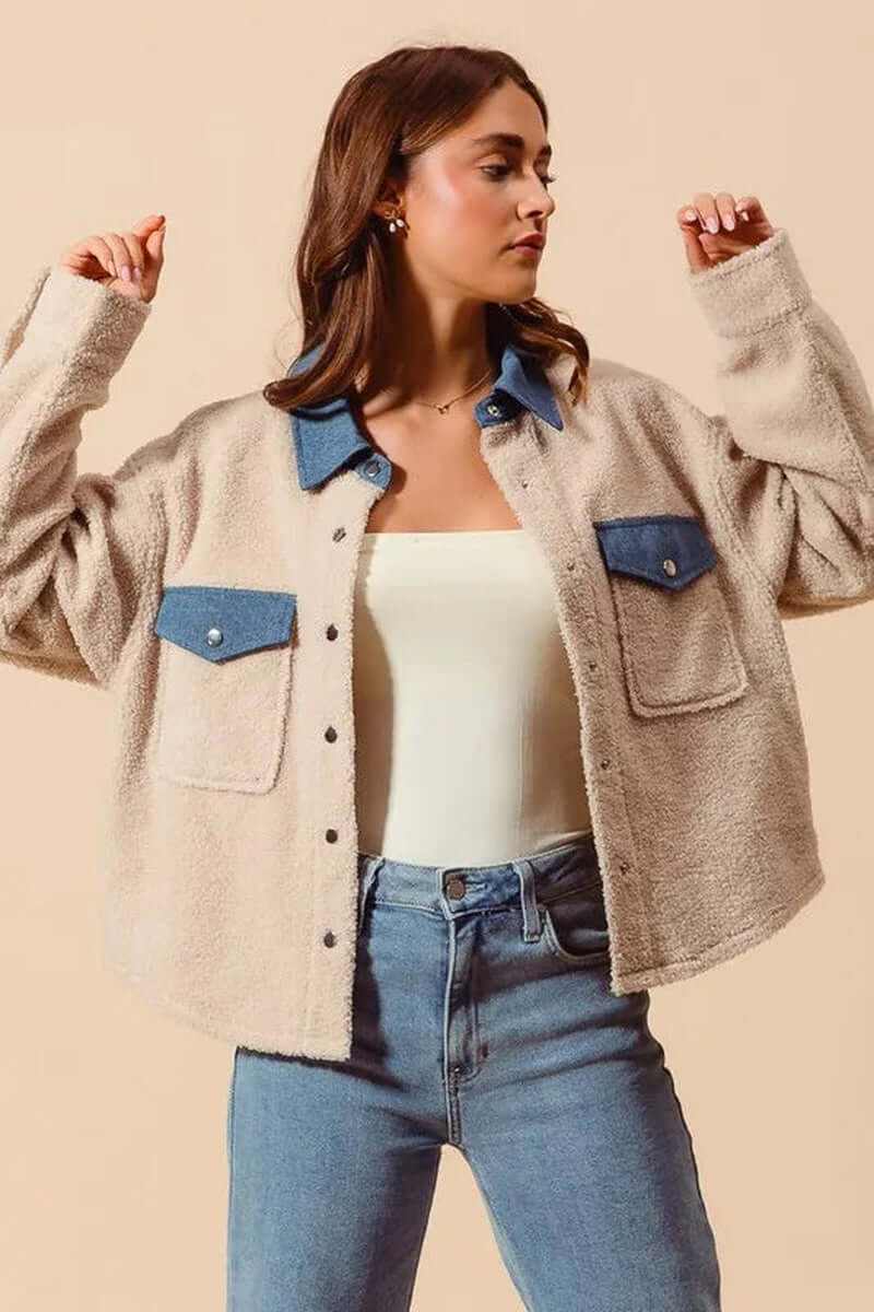 Woman wearing SO ME Faux Sherpa Fur Shacket with Denim Collar, showcasing cozy and stylish outerwear. Perfect for layering.