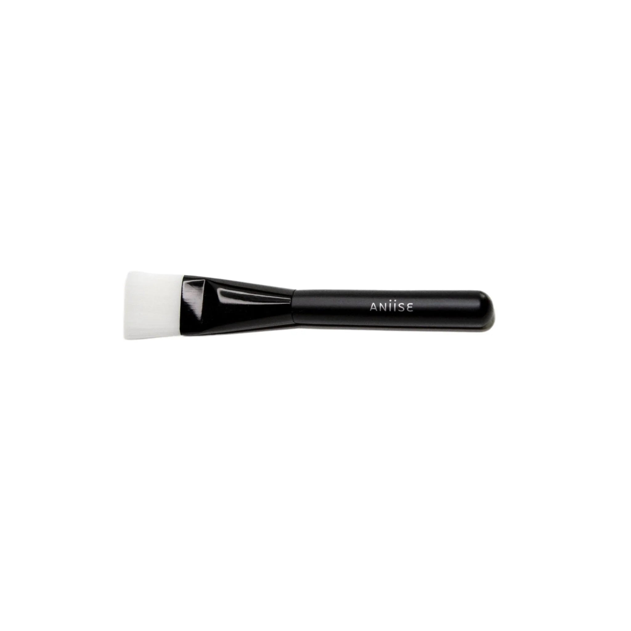 Soft professional synthetic face mask brush for applying skincare products evenly and mess-free.