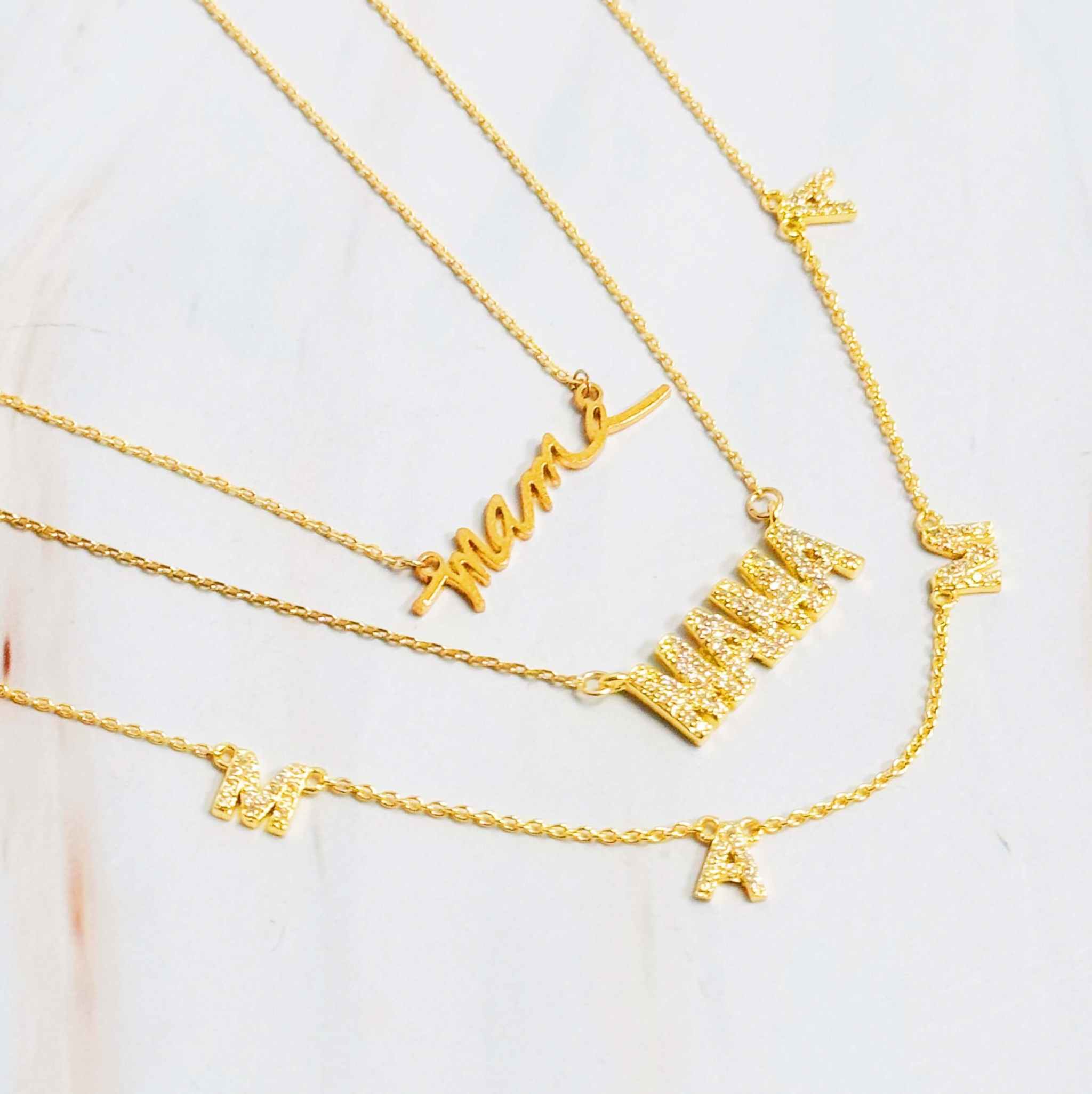 Sparkle Mama pendant necklace set in gold, featuring dainty designs with cubic zirconia, perfect gift for Mother's Day.