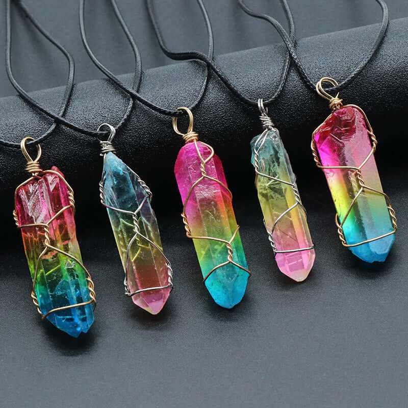 Colorful stone crystal pillar necklaces in various hues on black cords, showcasing a unique tree of life design.