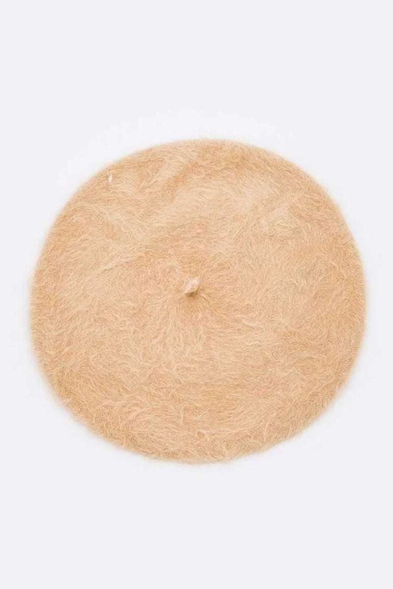 Stylish faux fur winter beret in soft beige, featuring a structured design for a chic, vintage look.