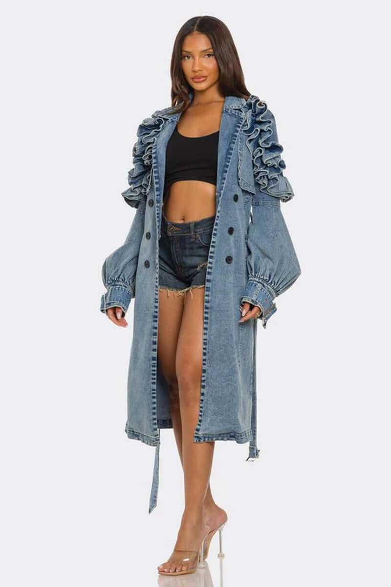 Woman wearing stylish ruffled edge denim trench coat with balloon sleeves and belted waist.