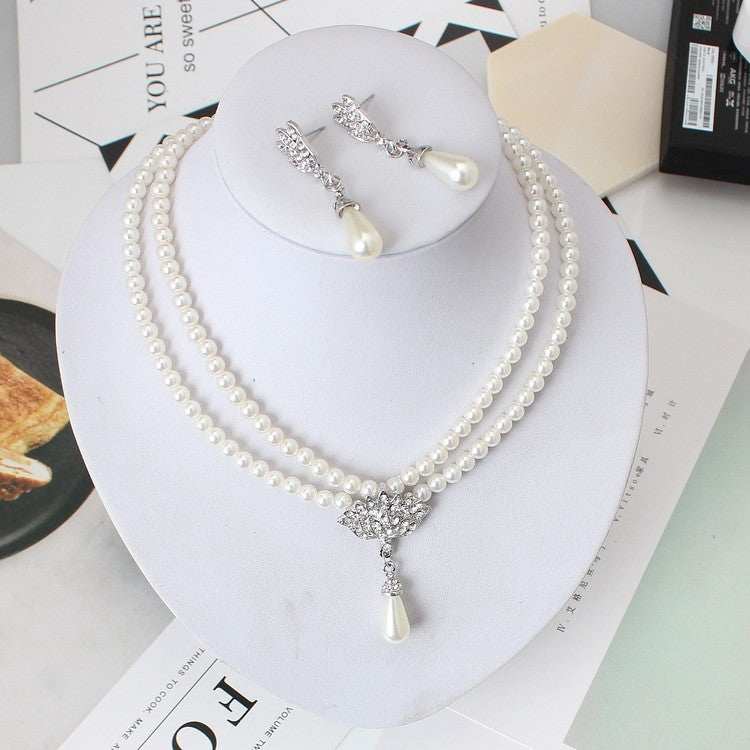 European wedding jewelry set with double pearl necklace and drop-shaped pendant earrings