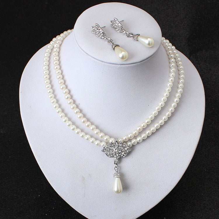 Elegant European wedding jewelry set featuring pearl necklace and drop-shaped pendant earrings