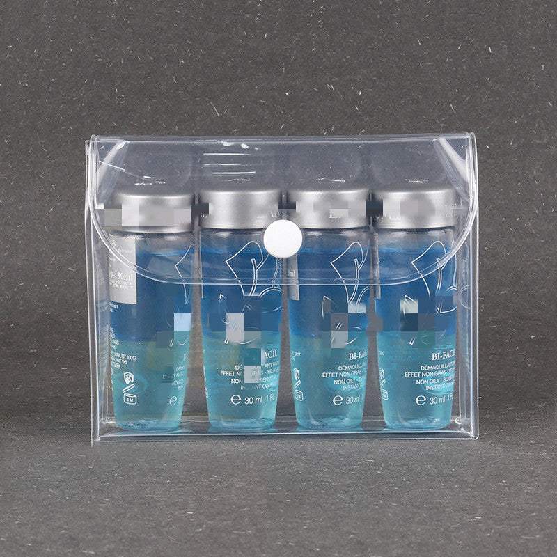 transparent waterproof cosmetics travel kit with four small blue bottles in clear EVA plastic case