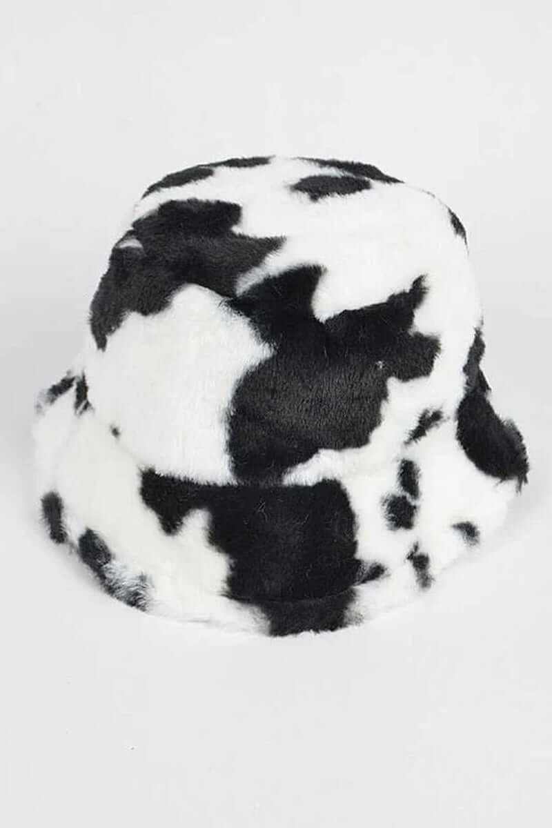 Trendy soft cow print faux fur bucket hat for fashionable winter style and comfort.