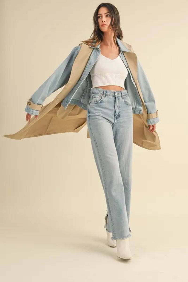 Model wearing Two-In-One MABLE Layered Trench Coat with Denim and light blue jeans for a trendy look.