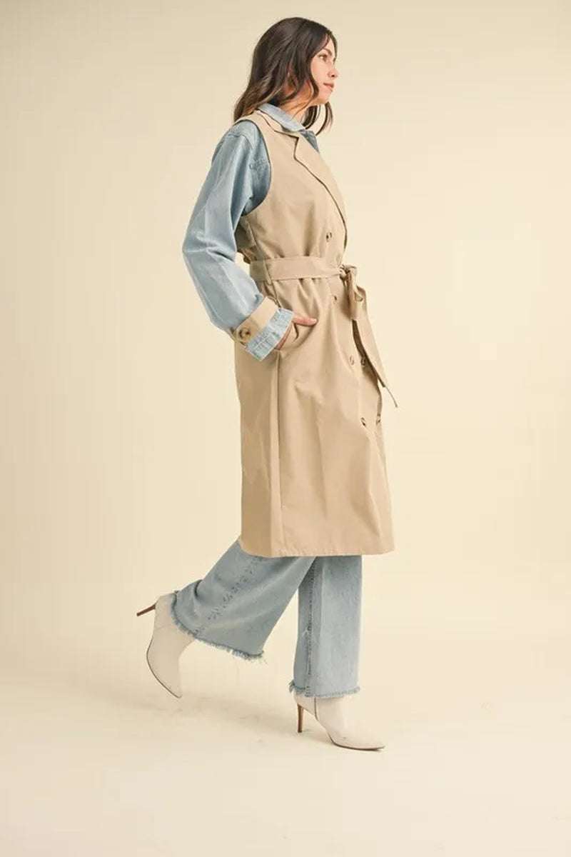 Woman modeling a Two-In-One MABLE layered trench coat and denim outfit, showcasing a stylish and versatile look.