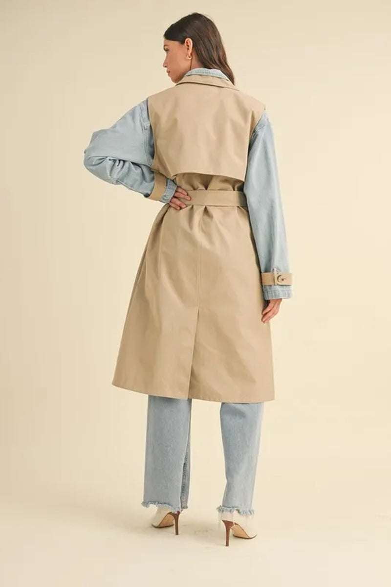 Back view of a model wearing a Two-In-One MABLE Layered Trench Coat with Denim, showcasing its stylish and functional design.