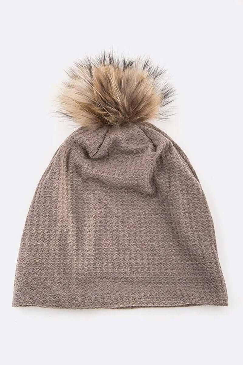 Warm knit slouchy beanie with faux fur pom pom, perfect for stylish winter warmth.