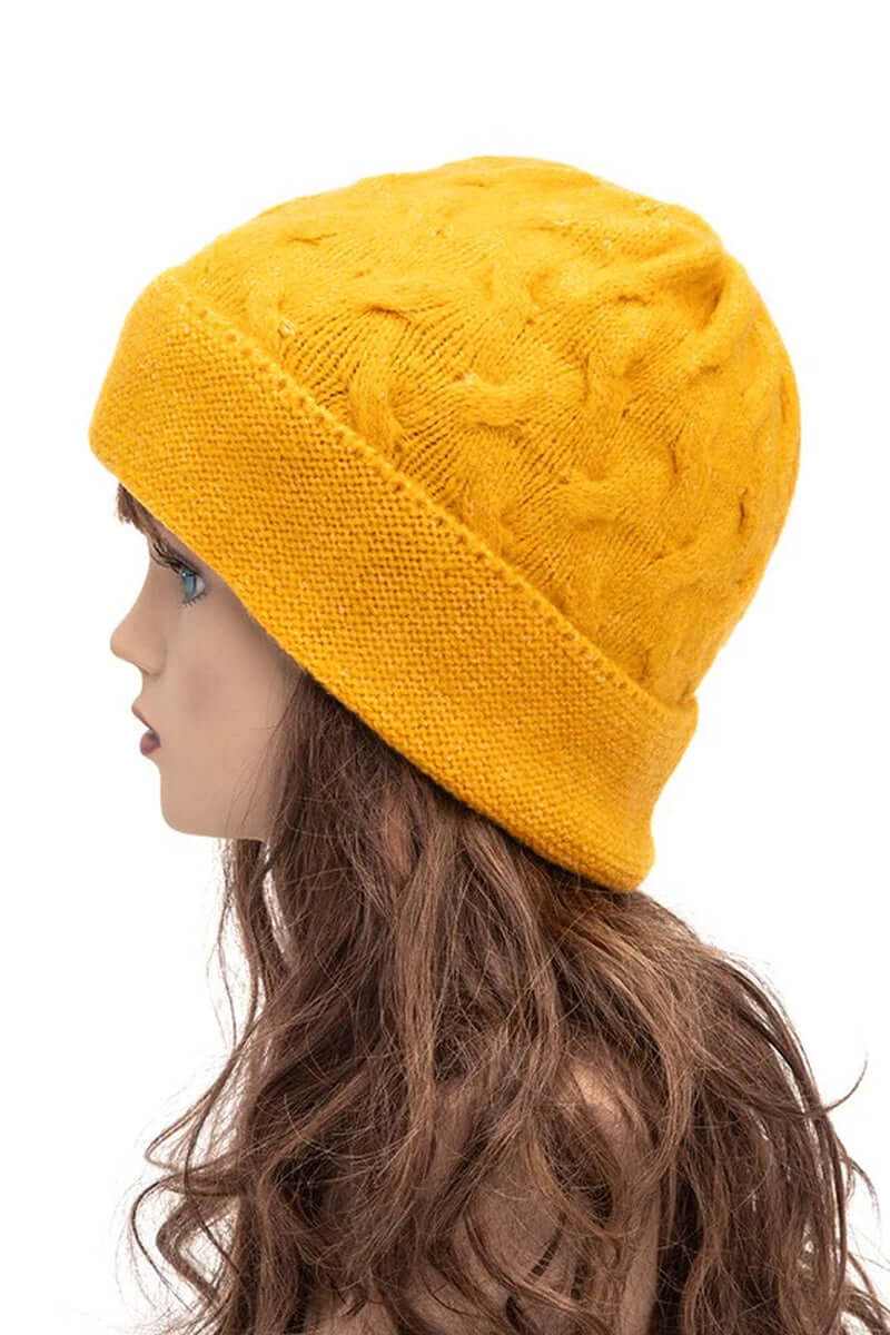 Warm slouchy wool blend cuffed beanie in bright yellow on a mannequin side profile.