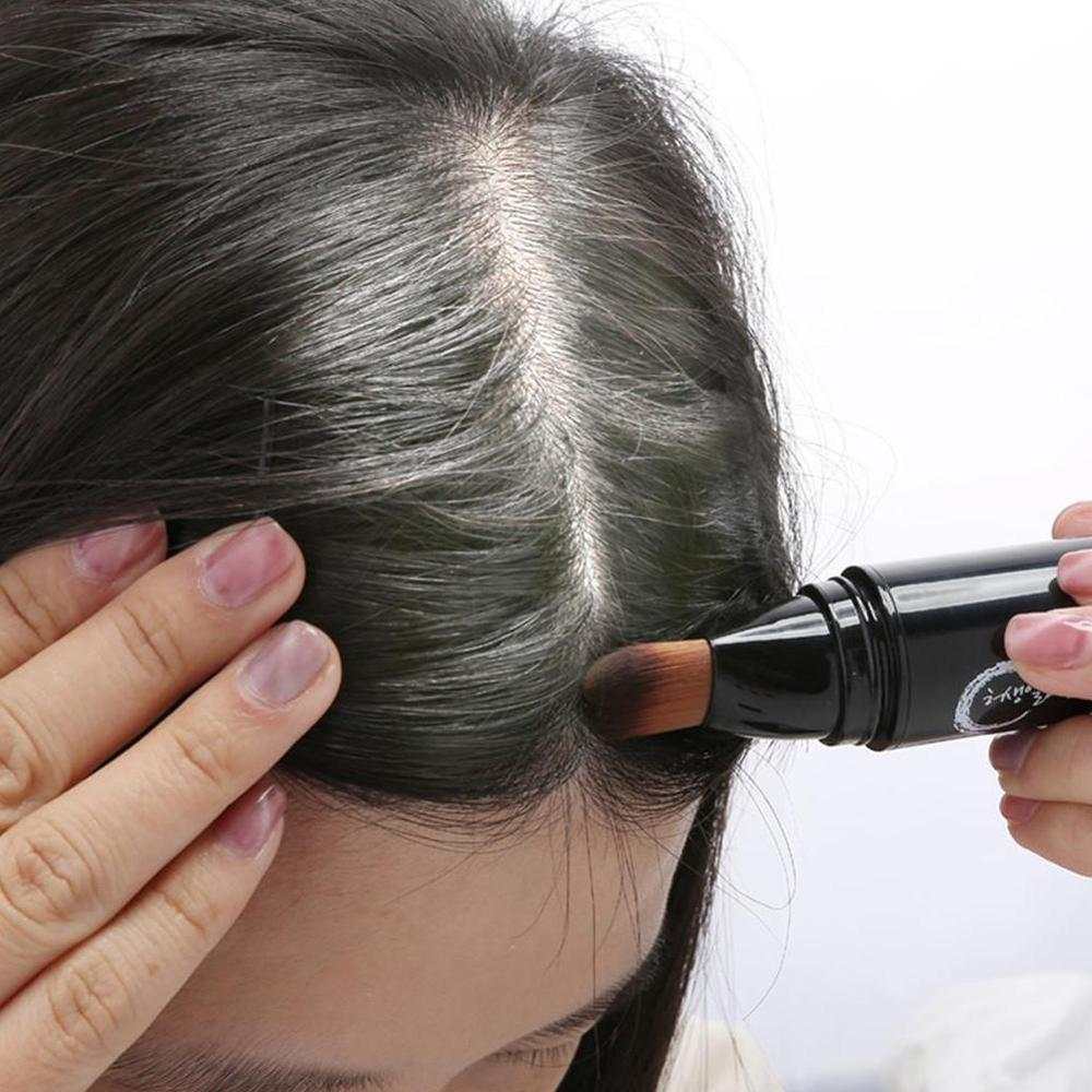 Woman applying washable and easy DIY hair color brush to roots for temporary hair dye and nourishment