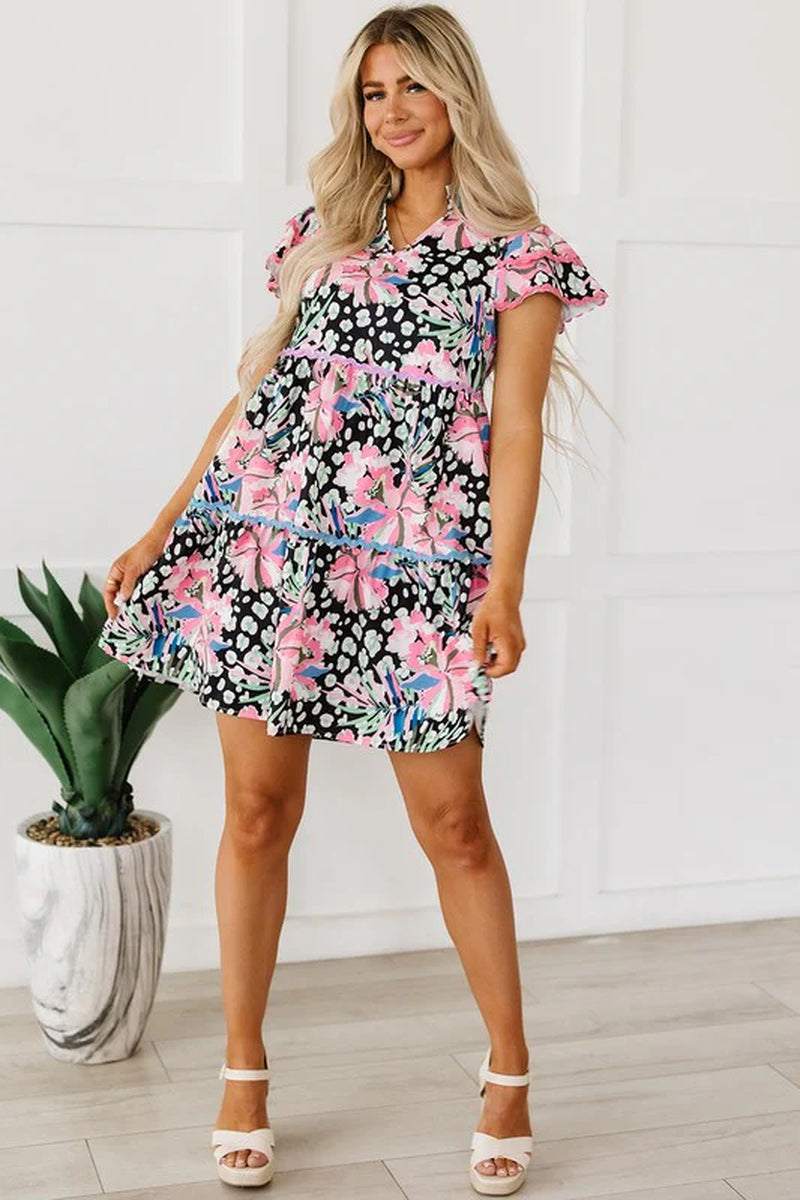 Women floral ricrac embellished tiered mini dress with short sleeves and playful design, perfect for warm weather.