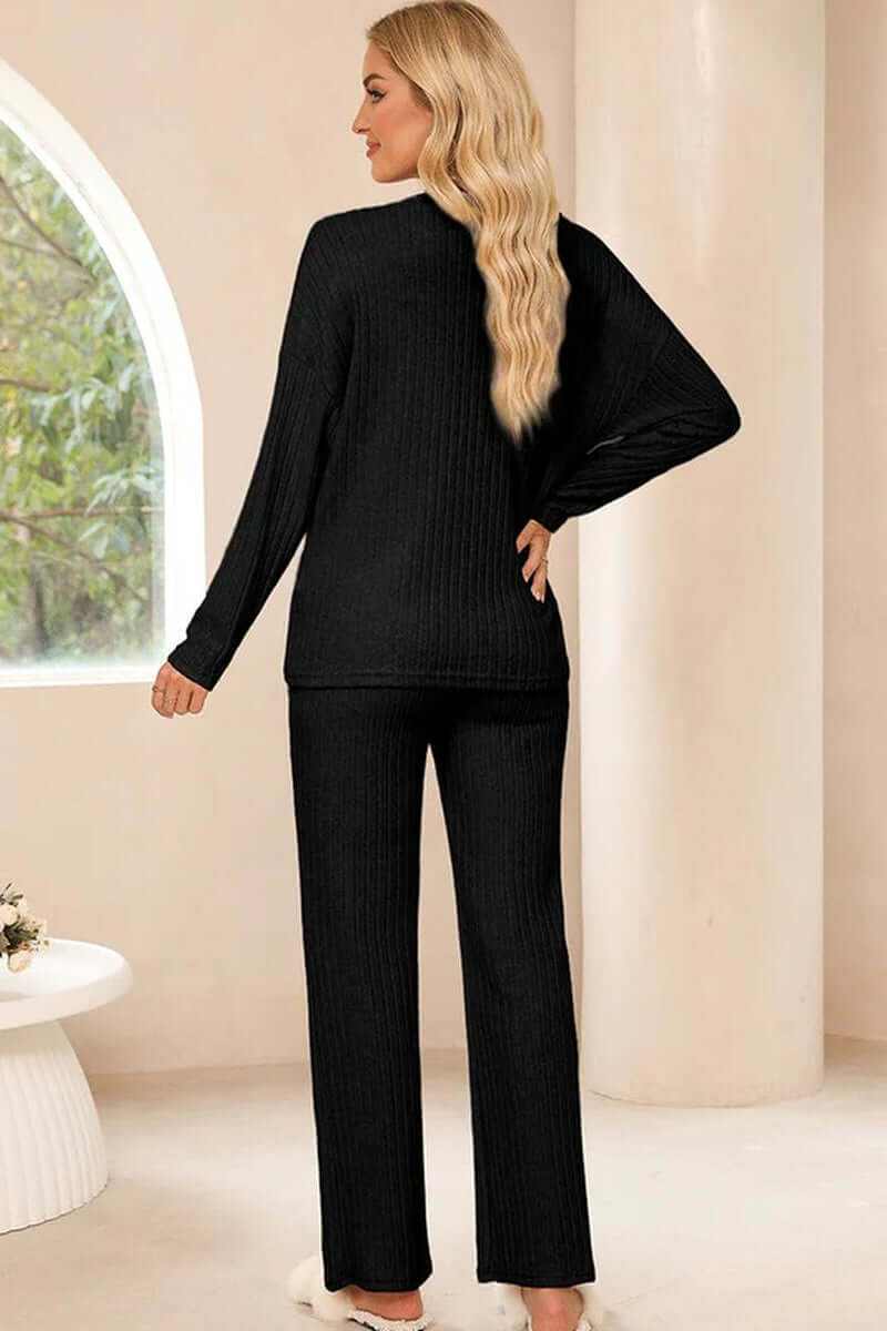 Women slouchy two-piece ribbed knit outfit in black, showcasing back view and elegant V-neck design.