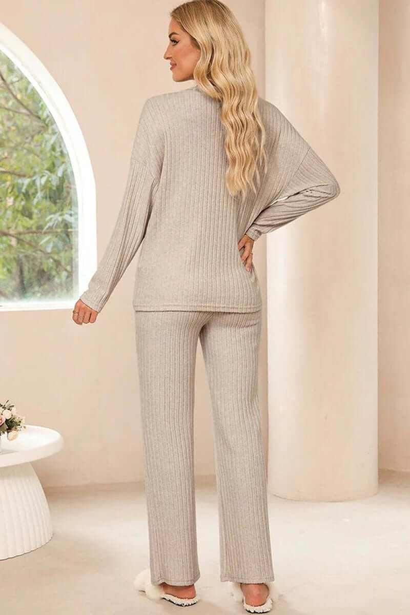Women's ribbed knit V-neck slouchy two-piece outfit in cozy beige, featuring a relaxed fit, perfect for versatile styling.