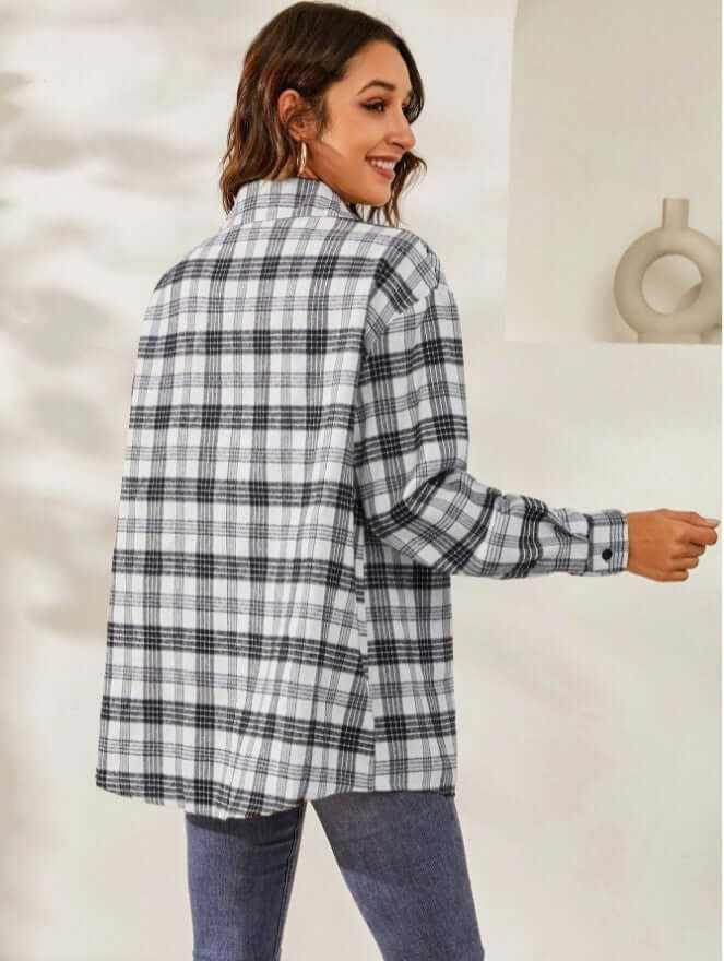 Woman wearing long sleeve plaid women's casual jacket in black and white polyester fabric