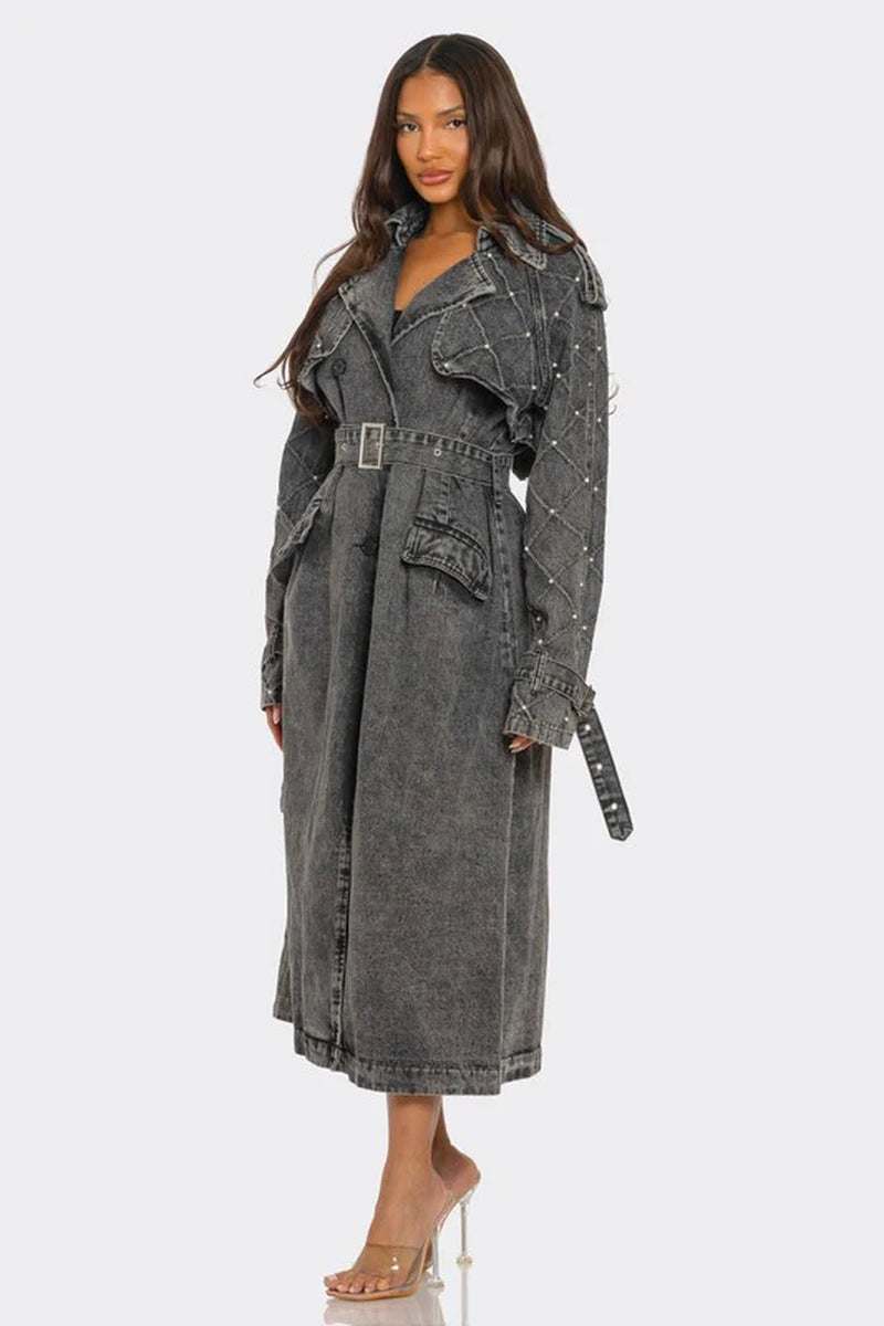 Women’s edgy distressed longline denim trench coat with quilted sleeves and studs, perfect for a stylish wardrobe update.
