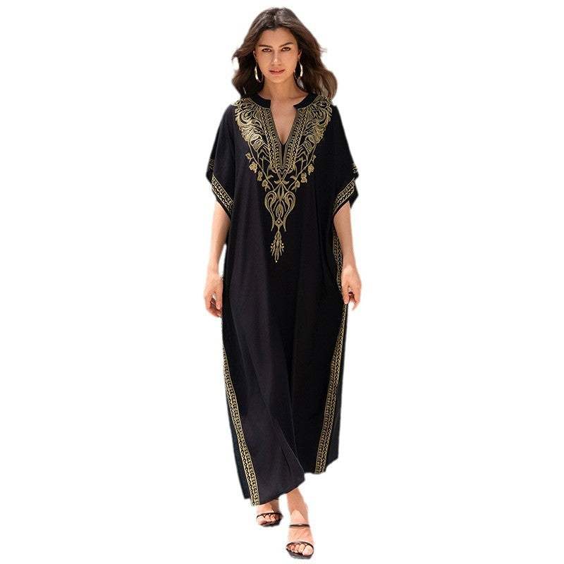 Women’s embroidered rayon cover-up in black, featuring elegant gold embroidery, perfect for swimming and beach outings.