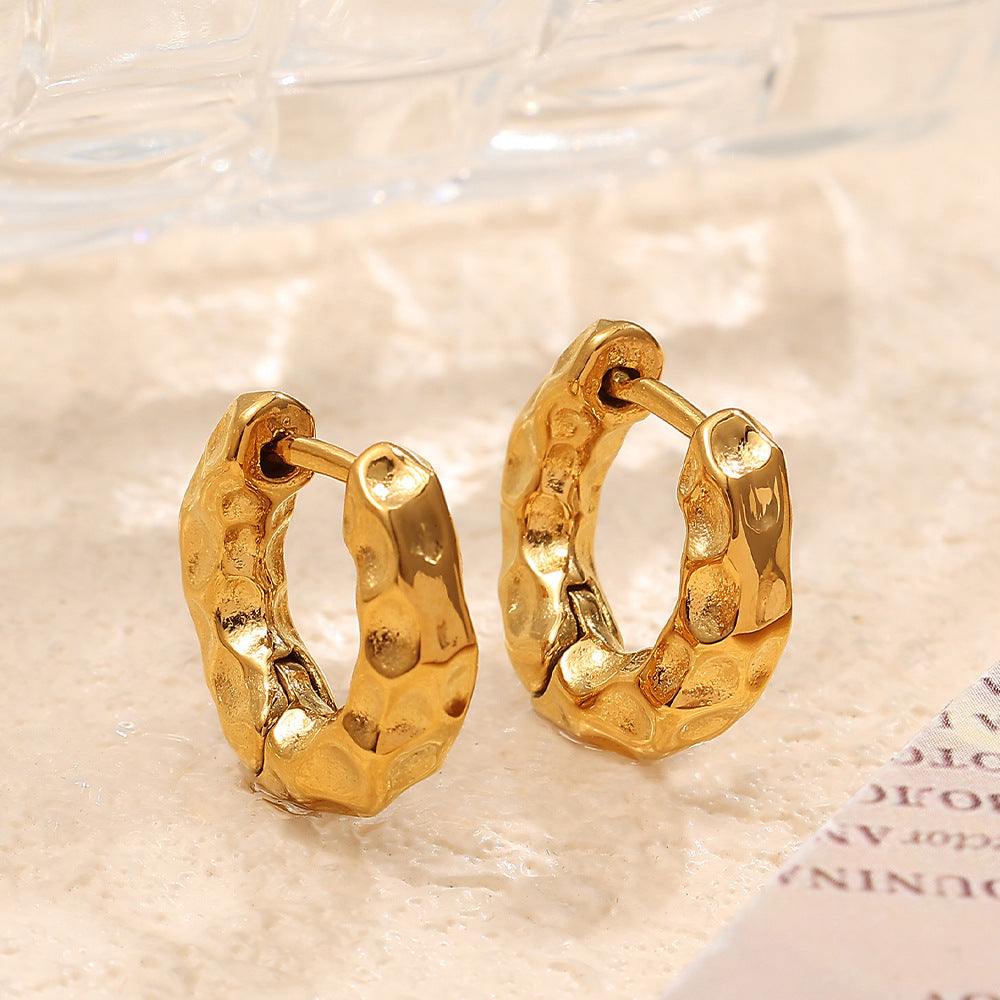 Gold women’s minimalist retro circle earrings made of titanium steel with electroplated finish