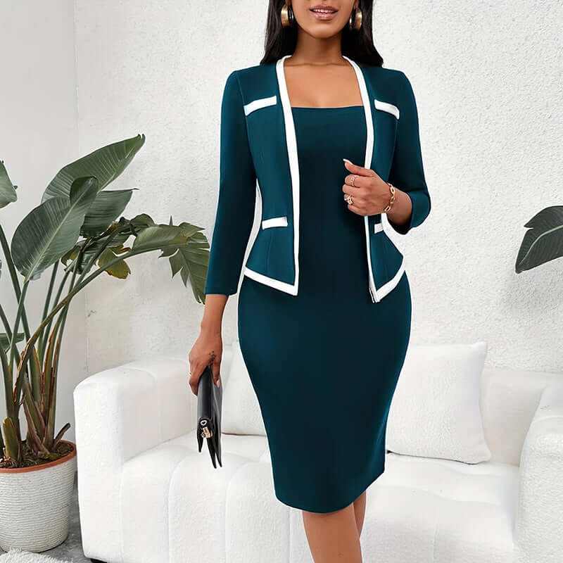 Woman wearing mock two-piece office dress with half sleeves and square neckline in teal with white trim