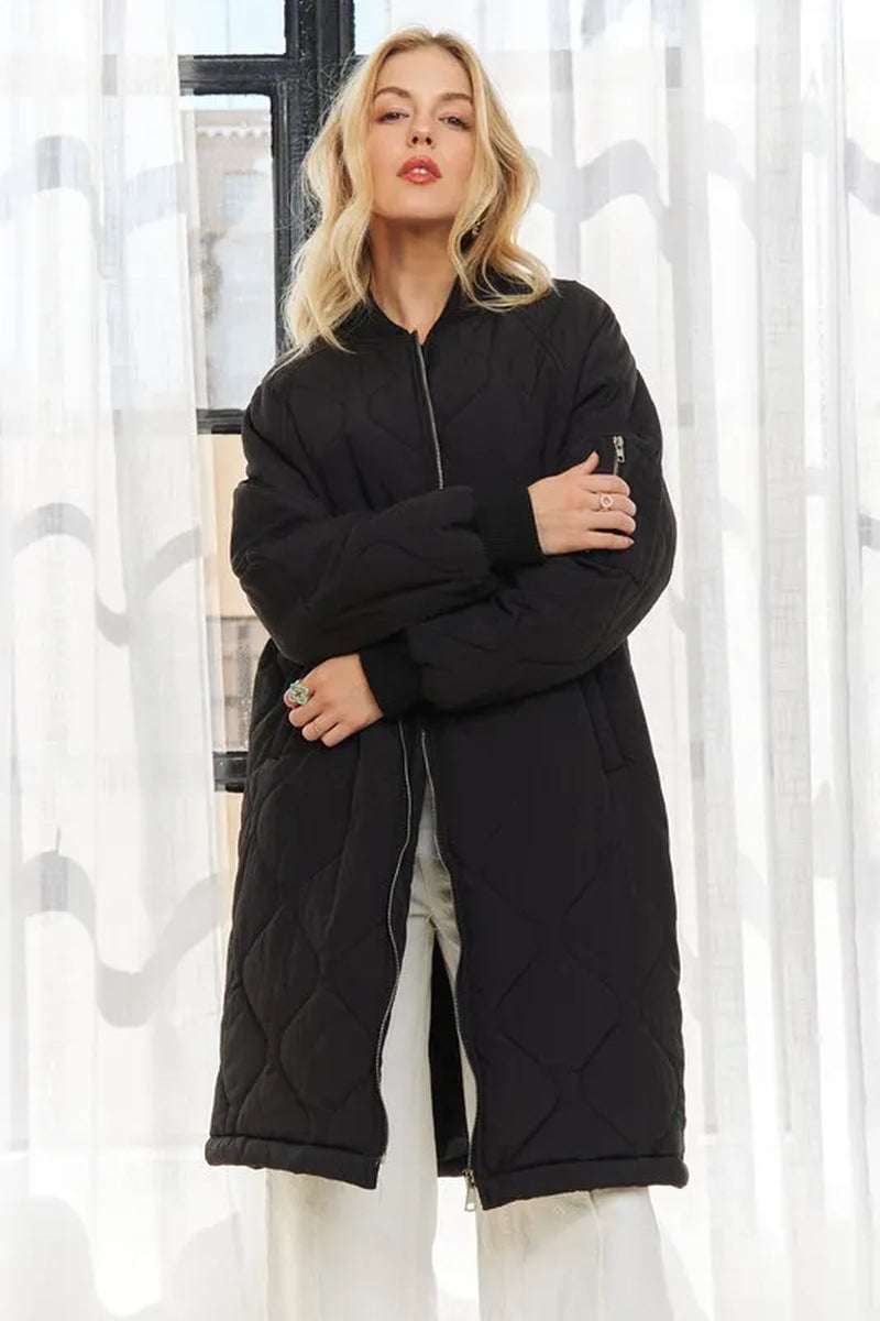 Stylish women's zip-up utility long jacket in black, featuring a quilted design and multiple pockets for practicality.